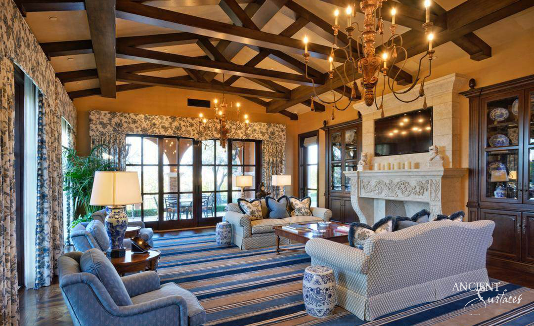 Antique reclaimed limestone mantel in a warm interior
