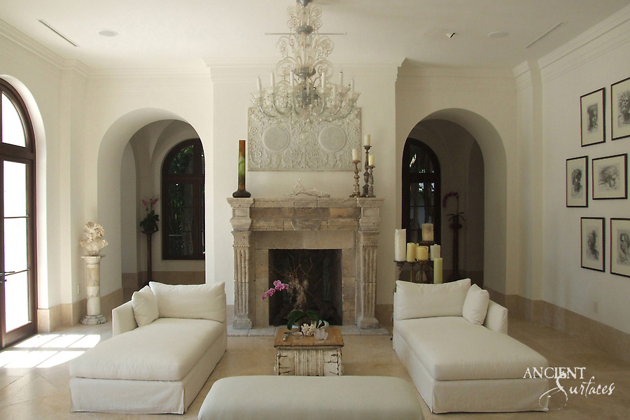 Antique reclaimed limestone mantel in a refined interior